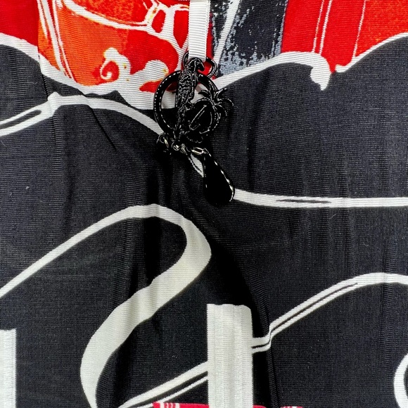 Save the Queen Ladies top. Medium Elbow length sleeves. Metal medallion accent. - Picture 5 of 13